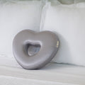 Longevity Pillow gray pillow on a white couch
